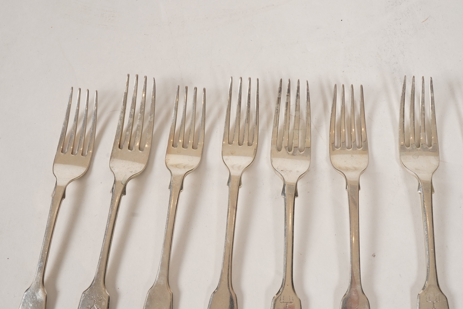 A set of twelve early Victorian provincial silver fiddle pattern table forks and six dessert forks by William Rawlings Sobey, Exeter, 1838, engraved 'Susanna Kingdon'